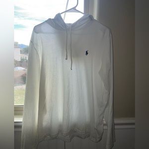 All white, has a hood and a dark blue logo on the front.